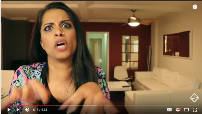 Lilly Singh makes an angry face and mimicks typing on a keyboard while she says “You’re a terrorist."