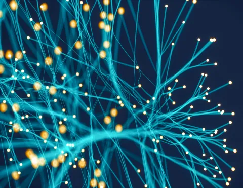 Close-up digital rendering of glowing cyan filaments branching outward with bright orange nodes at their tips, resembling a neural network against a dark blue background.