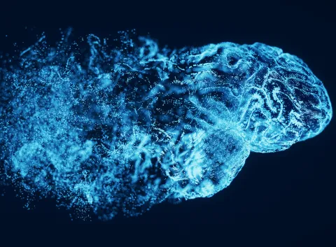 blue digital interpretation of a disintegrating human brain