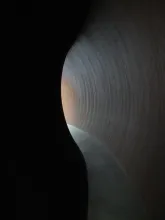 image of a dark tunnel with light at the end