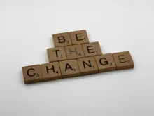 Game pieces spelling "Be the Change"