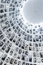 Wall of photographs portraying victims of the Shoah