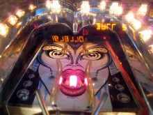 Pinball machine with image of a person face as the design