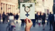 Person holding a paper with the lgbt symbol