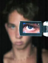 A person's eye closeup on a camera